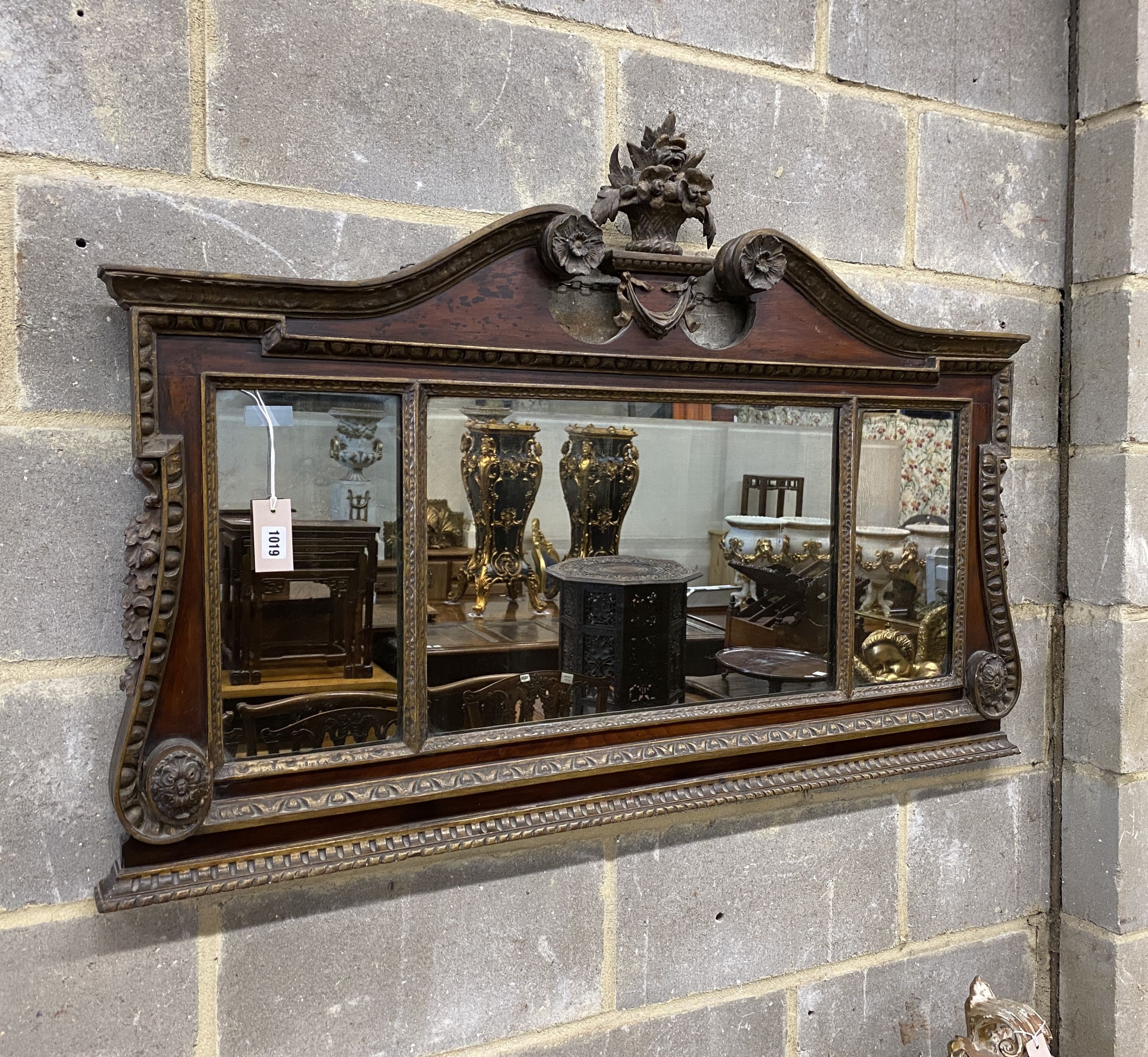 A George II style parcel gilt mahogany overmantel mirror, width 119cm, height 78cm